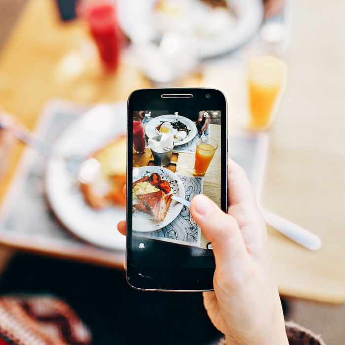 Taking photo of food using smart phone Stock Photo - Alamy
